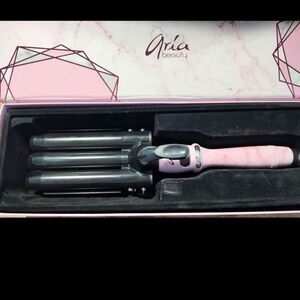 ARIA three barrel curling iron. Like new condition in box.